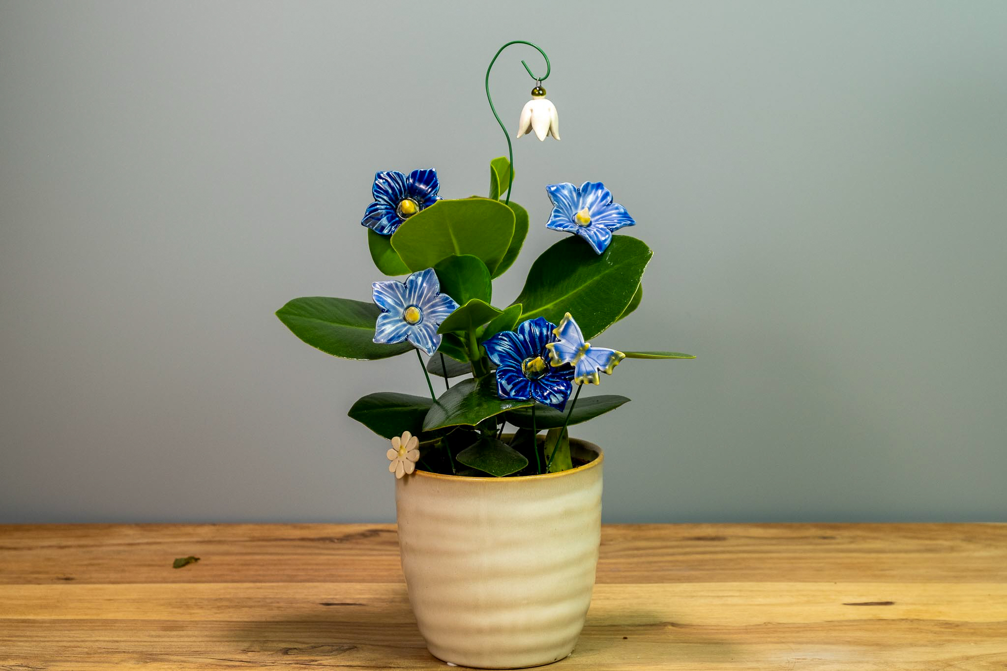 ceramic flowers with live houseplant