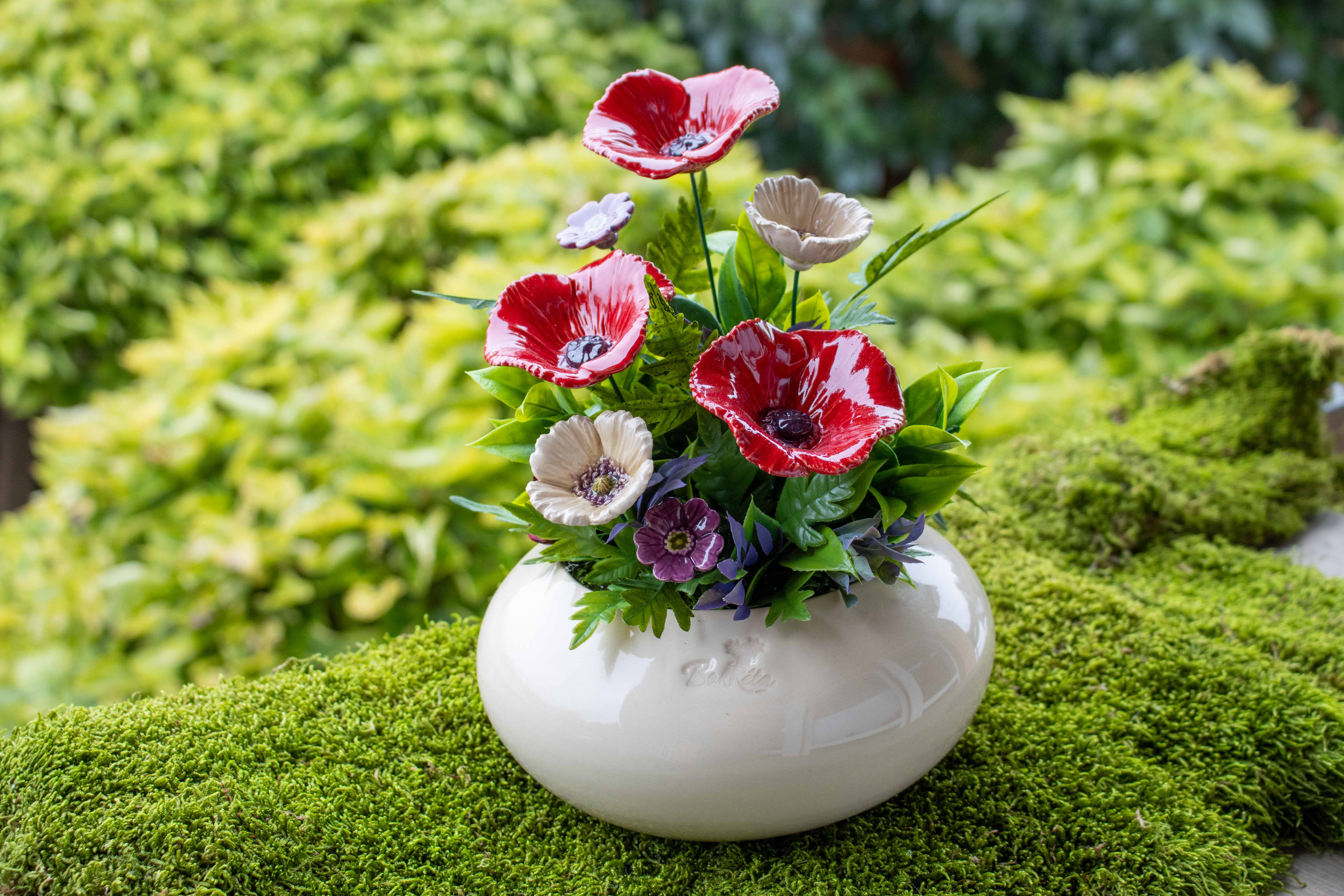 poppy ceramic decoration in the garden
