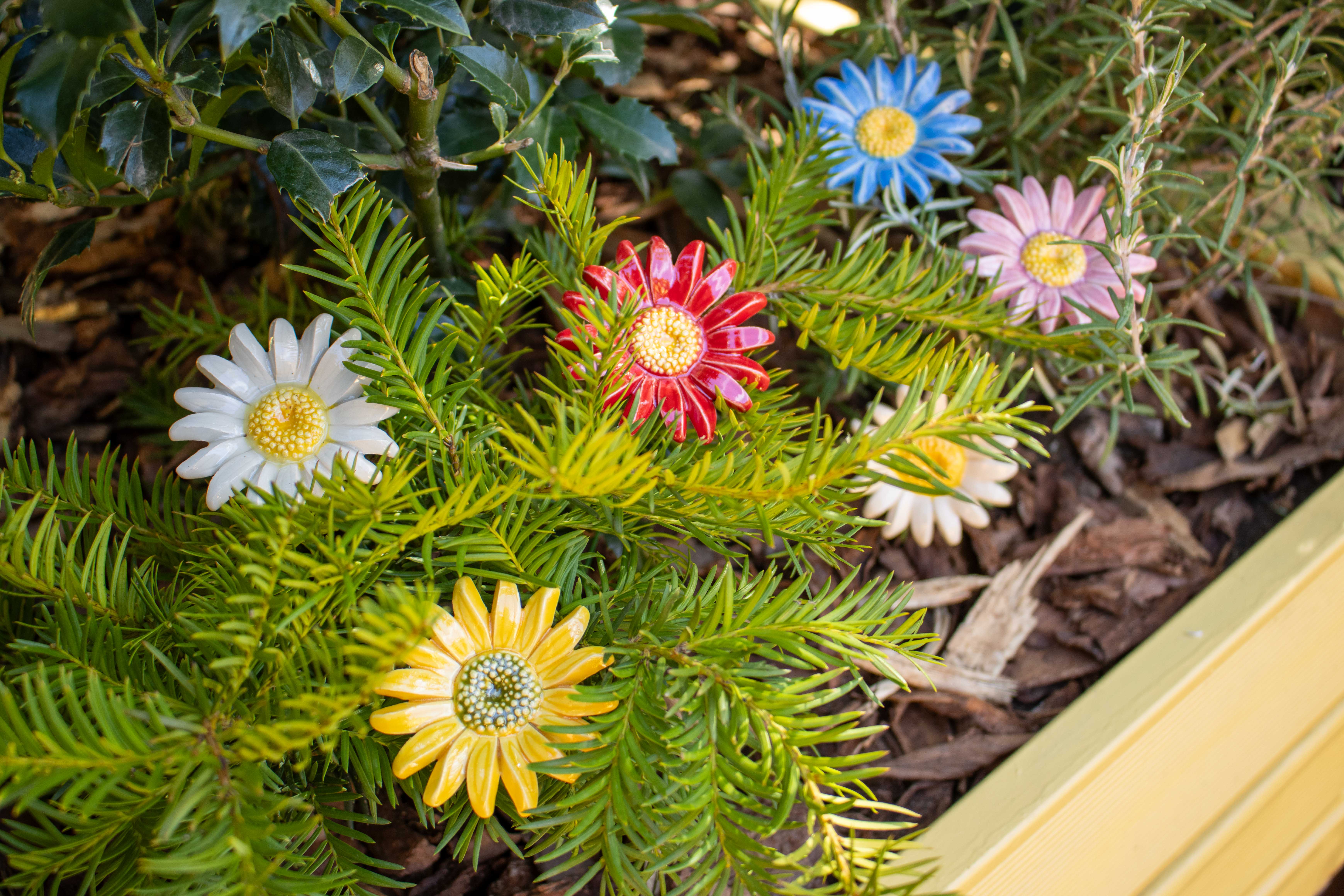 Ceramic daisy in the garden